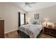 Cozy bedroom with a full bed and hardwood floors at 5738 Leigh Ln, The Villages, FL 32163