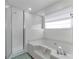 Clean bathroom with a large tub and a separate shower at 1150 Angela Ridge Ct, Kissimmee, FL 34747