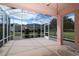 Relaxing screened porch with ceiling fan and outdoor seating at 13162 Se 93Rd Terrace Rd, Summerfield, FL 34491