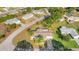 Wide aerial view of a neighborhood with a focus on a single-Gathering home at 17569 Se 107Th Ct, Summerfield, FL 34491