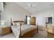 Spacious main bedroom with wooden furniture and an attached bathroom at 2306 Edmonton Ct, Clermont, FL 34711