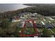 Aerial view highlighting a home's private backyard and waterfront access at 34932 Golden Tree Dr, Leesburg, FL 34788