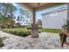 Outdoor patio with built-in grill and pavers at 34932 Golden Tree Dr, Leesburg, FL 34788
