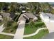 Aerial view of a residential area showcasing a home with landscaping at 34932 Golden Tree Dr, Leesburg, FL 34788