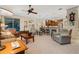 Living room with open kitchen access and seating area at 34932 Golden Tree Dr, Leesburg, FL 34788