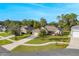 Aerial view of a single Gathering home and surrounding houses at 34932 Golden Tree Dr, Leesburg, FL 34788