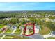 Aerial view showcasing a single-Gathering home in a residential neighborhood at 34932 Golden Tree Dr, Leesburg, FL 34788