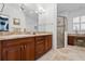 Double vanity bathroom with a large shower and plenty of counter space at 34932 Golden Tree Dr, Leesburg, FL 34788