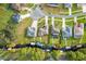 Aerial view showcasing a row of homes along a canal at 34932 Golden Tree Dr, Leesburg, FL 34788