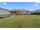 Large backyard with a view of home during the day at 34932 Golden Tree Dr, Leesburg, FL 34788