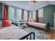 Charming bedroom with twin beds, and large windows at 351 W 10Th Ave, Mount Dora, FL 32757