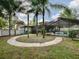 Backyard with curved walkway, pool, and lush greenery at 351 W 10Th Ave, Mount Dora, FL 32757