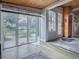 Bright sunroom with backyard access and wood floors at 351 W 10Th Ave, Mount Dora, FL 32757