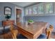 Formal dining room featuring a vintage inlaid wood table at 351 W 10Th Ave, Mount Dora, FL 32757