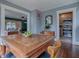 Dining room featuring a wood table and view into the adjacent kitchen at 351 W 10Th Ave, Mount Dora, FL 32757