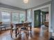 Charming dining room features hardwood floors and vintage table at 351 W 10Th Ave, Mount Dora, FL 32757