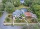 House with a gray roof, a pool, and a large backyard at 351 W 10Th Ave, Mount Dora, FL 32757