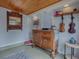 Bright sunroom with wood ceiling, antique cabinet, and window views at 351 W 10Th Ave, Mount Dora, FL 32757