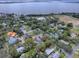 Aerial view of a charming house with a spacious backyard, located in a desirable neighborhood at 351 W 10Th Ave, Mount Dora, FL 32757