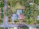 House with a gray roof, a pool, and a large backyard at 351 W 10Th Ave, Mount Dora, FL 32757