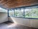Screened porch with wood ceiling and view of backyard at 351 W 10Th Ave, Mount Dora, FL 32757