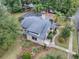 House with a gray roof, a pool, and a large backyard at 351 W 10Th Ave, Mount Dora, FL 32757