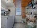 Clean laundry room with washer, dryer, shelves, and window at 351 W 10Th Ave, Mount Dora, FL 32757