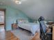 Spacious bedroom with light blue walls, wood floors and a comfortable bed at 351 W 10Th Ave, Mount Dora, FL 32757