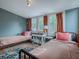 Bedroom with twin beds, a writing desk, and a rug at 351 W 10Th Ave, Mount Dora, FL 32757