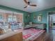 Open living room with green walls and a view to the dining area at 351 W 10Th Ave, Mount Dora, FL 32757