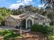 One-story house with a two-car garage at 3646 Westover Cir, Leesburg, FL 34748