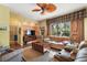 Relaxing living room with leather furniture and wood accents at 3646 Westover Cir, Leesburg, FL 34748