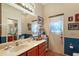Bathroom with vanity and exterior access at 3646 Westover Cir, Leesburg, FL 34748