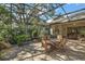 Covered patio perfect for outdoor dining and relaxation at 3646 Westover Cir, Leesburg, FL 34748