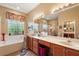 Double vanity bathroom with soaking tub and shower at 3646 Westover Cir, Leesburg, FL 34748