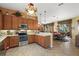 Eat-in kitchen features stainless steel appliances and ample counter space at 3646 Westover Cir, Leesburg, FL 34748