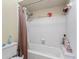 Clean bathroom with shower/tub combo and tile surround at 36520 Micro Racetrack Rd, Fruitland Park, FL 34731