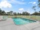 Rectangular swimming pool with surrounding patio and lounge chairs at 36520 Micro Racetrack Rd, Fruitland Park, FL 34731