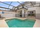 Private pool with a fun mural and screened enclosure at 4847 Clock Tower Dr, Kissimmee, FL 34746