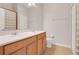 Bathroom with double vanity, beige tile flooring and shower with striped curtain at 513 Juniper Springs Dr, Groveland, FL 34736