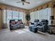 Relax in this inviting media room, featuring comfortable recliners and built-in shelving at 8913 Se 132Nd Loop, Summerfield, FL 34491
