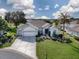 Single-Gathering home with two-car garage and manicured landscaping at 8913 Se 132Nd Loop, Summerfield, FL 34491