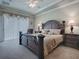 Main bedroom with king bed, private access and sitting area at 8913 Se 132Nd Loop, Summerfield, FL 34491