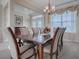 Formal dining room with large table, chairs, and chandelier at 8913 Se 132Nd Loop, Summerfield, FL 34491