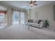 Relaxing living room featuring a plush sofa and glass coffee table at 8913 Se 132Nd Loop, Summerfield, FL 34491