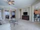 Open concept living room with views of dining and kitchen areas at 8913 Se 132Nd Loop, Summerfield, FL 34491