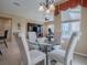 Casual breakfast nook with round glass table and four chairs at 8913 Se 132Nd Loop, Summerfield, FL 34491