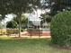 Community memorial area with benches and American flags at 8913 Se 132Nd Loop, Summerfield, FL 34491