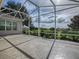 Enjoy the view from this screened patio with stamped concrete floor at 8913 Se 132Nd Loop, Summerfield, FL 34491