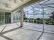 Spacious screened patio with stamped concrete floor and golf course view at 8913 Se 132Nd Loop, Summerfield, FL 34491